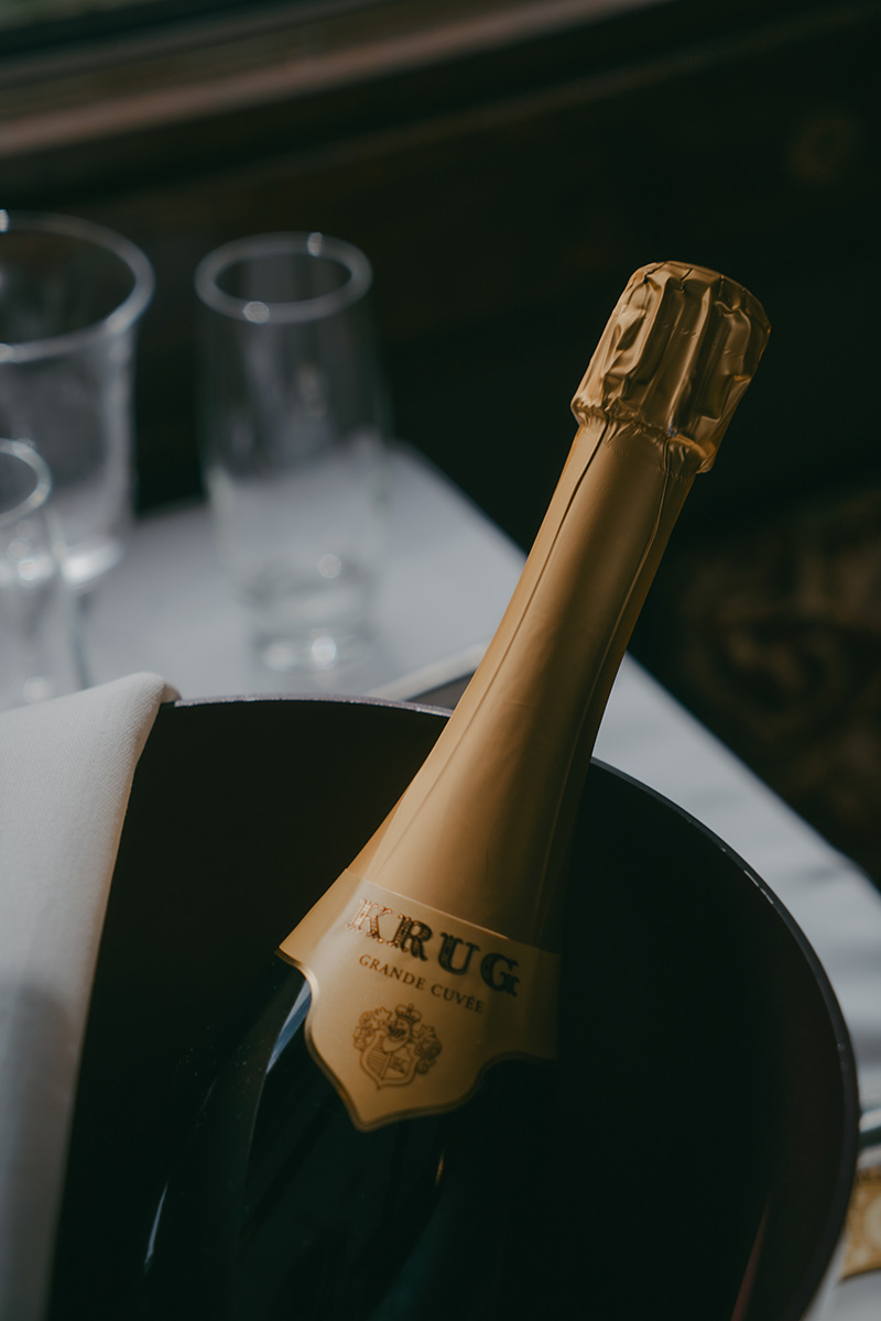 Image of a bottle of KRUG in a ice bucket on the table of Northern Belle train